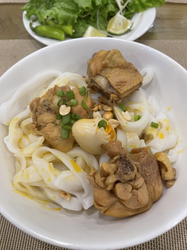 Breakfast of chicken noodle soup at the Dolphin Hotel and Apartments, Da Nang, Vietnam