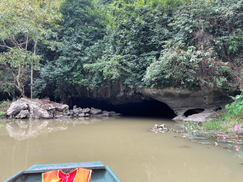 Entering the Buddha cave in Thung Nham bird park, Nimh Binh