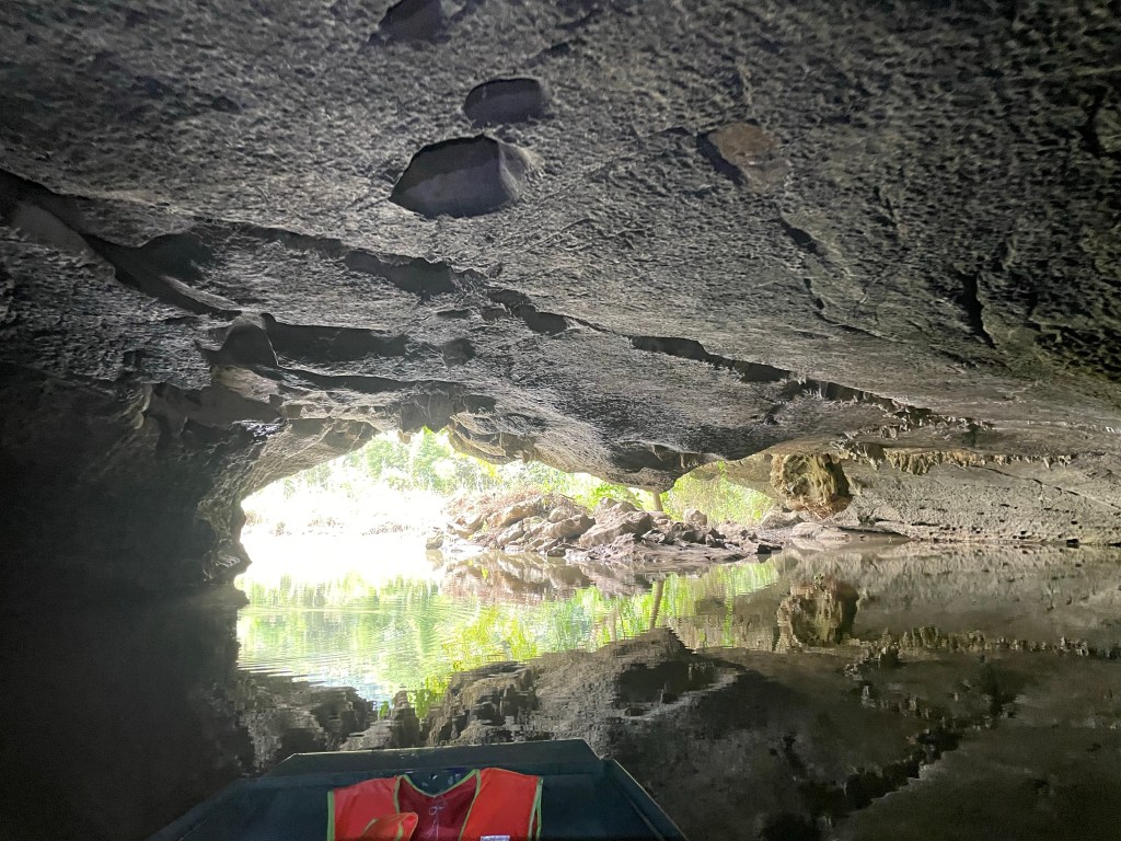 Entering the Buddha cave in Thung Nham bird park, Nimh Binh