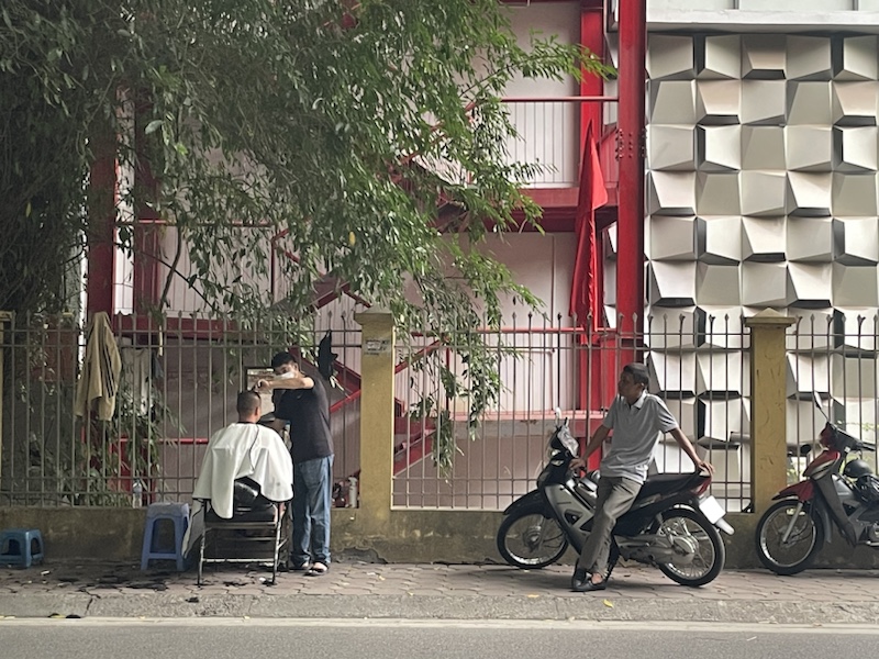 A street barber in Hanoi, Vietnam