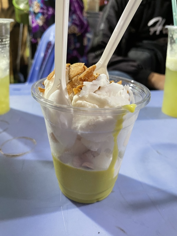 Sugar cane juice and coconut ice cream at Kem Bo, one of the street food market stalls in Ho Chi Minh City, Vietnam