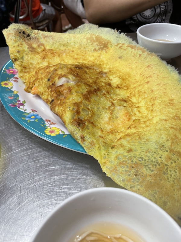Crispy pancakes filled with prawns and pork at Bánh Xèo Ngọc Sơn, Ho Chi Minh City, Vietnam