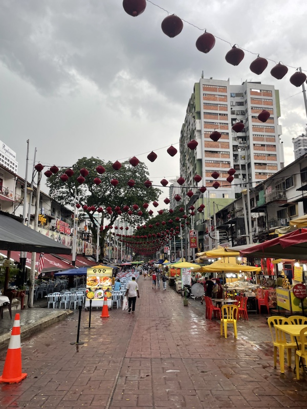 Jalan Alor is a famous foodie street in Kuala Lumpur, Malaysia but was very quiet on a wet afternoon 