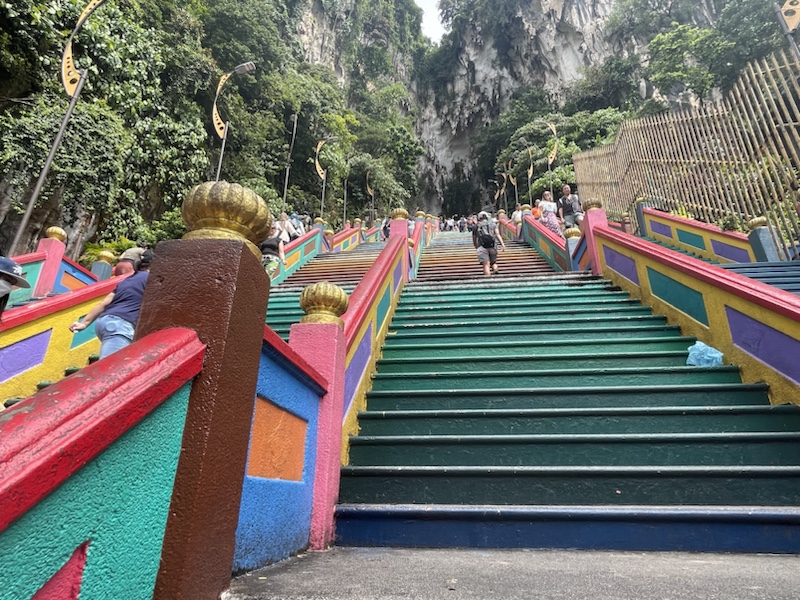 There are 272 brightly coloured steps to climb to reach Batu caves​, in Kuala Lumpur, Malaysia 