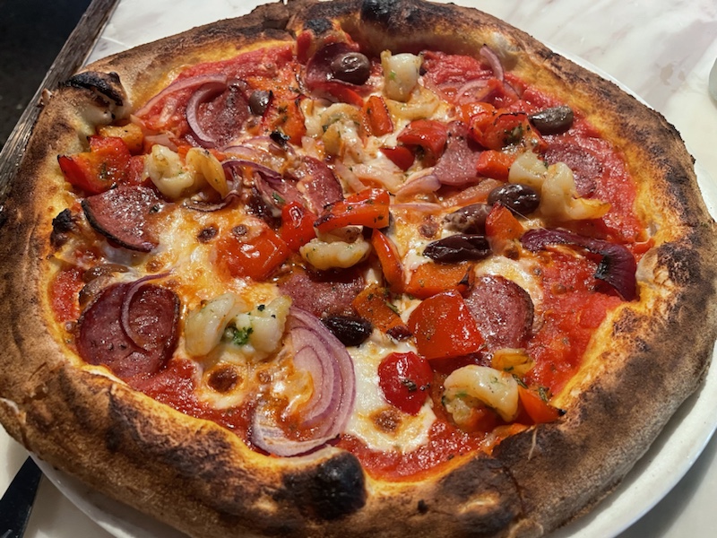 Our prawn and pepperoni pizza at Macchiato Wood Fire Pizza and Coffee Roasters in Sydney, NSW, Australia 